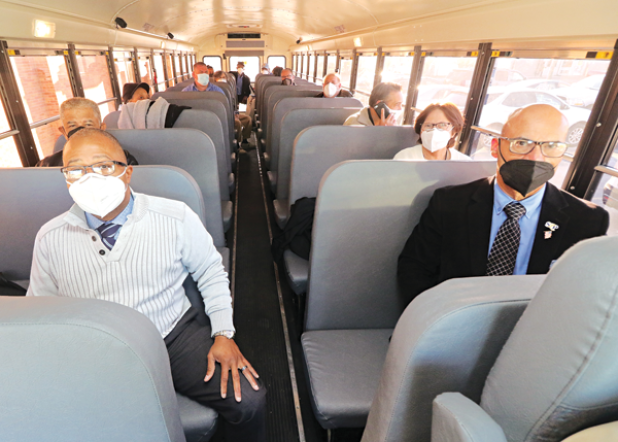 Several St. Landry Parish School Board members rode a school bus to West Feliciana Parish to view a school under construction. Seated in front are Superintendent Patrick Jenkins and Board member Myron Guillory. (Photos by Harlan Kirgan)