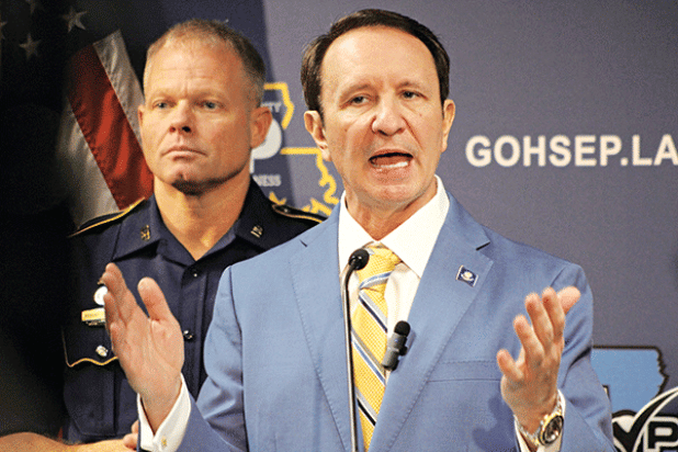 Gov. Jeff Landry addresses reporters Wednesday on extra security precautions in New Orleans for Super Bowl LIX. Louisiana State Police Superintendent Col. Robert Hodges, left, took part in the news conference with the governor at the Office of Homeland Security and Emergency Preparedness in Baton Rouge. (Greg LaRose/Louisiana Illuminator)