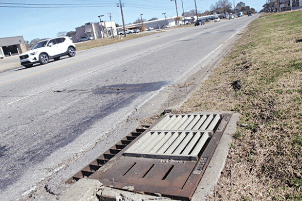 The slots on the curb side drains on U.S. 190 are credited in part with sparing the road from flooding on Jan. 24 and at other times. Mayor Scott Fontenot said Eunice may have been spared the worst of the heavy rainfall, but state Department of Transportation and Development’s installation of the slotted drain lids helped with drainage. (Photo by Harlan Kirgan) 