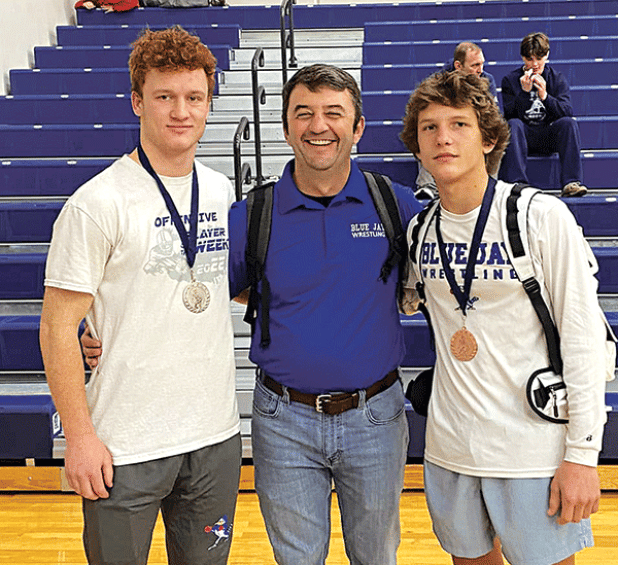 St Edmund Blue Jay wrestlers competed at the Lafayette Metro Wrestling meet on Saturday. Henry Summerlin received second place in his weight class and Cooper Berzas took home third place in his eight class. From left, are Summerlin, Coach Shane Lebleu, and Berzas. (Submitted photo)