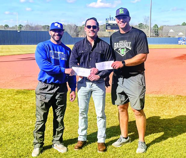 Perry Pitre Ford’s Perry Pitre IV presents a donation check to St. Edmund head baseball coach Casey Charlie and Eunice High head baseball coach Stuart Turner. The two schools put on the annual Perry Pitre Ford Jamboree every year. The two-day event features junior varsity programs on Friday night and varsity programs on Saturday. (Submitted photo)