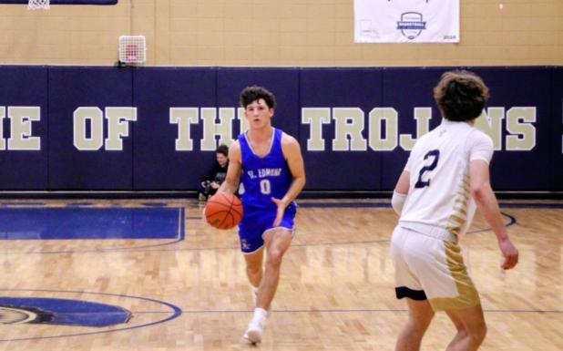 St. Edmund Senior Owen Cart brings the ball up in Friday’s game against Sacred Heart. (Photos by Sports Editor Rhett Manuel)