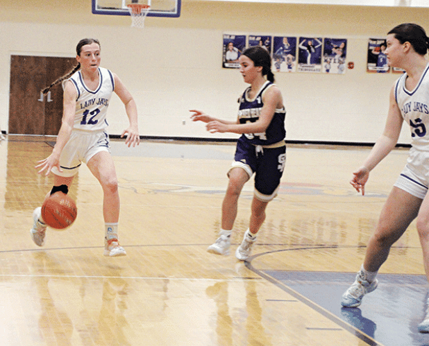 Junior guard Caroline Lavergne drives to the hoop last week against Sacred Heart. Lavergne again led the Lady Jays in scoring with 16 points in a 54-22 win over Catholic-Pointe Coupee on Tuesday night in District 5-1A play to improve St. Ed’s record to 20-3 on the season. (Photo by Rhett Manuel)