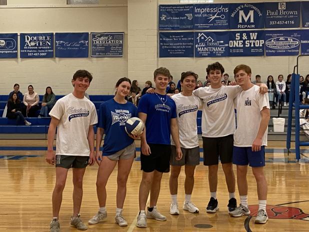 A volleyball game of St. Ed seniors versus the St. Ed faculty and staff