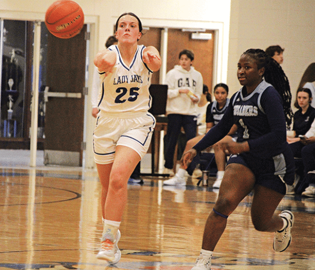 St. Ed’s senior player Millie Miller fires a pass in the Lady Jays’ 49-46 overtime win over Westminster Christian on Tuesday night. Miller finished the game with seven points but hit a crucial pair of free throws in the overtime period to help seal the win. (Photo by Rhett Manuel)