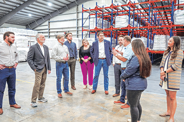 Bobby  Hanks, third from right, owner of Supreme Rice,  speaks to a delegation of state officials participating in an economic tour of Acadia Parish recently. From left are, Rep. Chance Henry; Sen. Bob Hensgens; Danny Nugier, vice president of operations, Supreme Rice; Paul Hundley, assistant to Rep. Phillip DeVillier; Taylor Henry, director of business development and events, Acadia Parish Chamber of Commerce and Economic Development; Rep. Ryan Bourriaque; Speaker of the Louisiana House of Representatives 