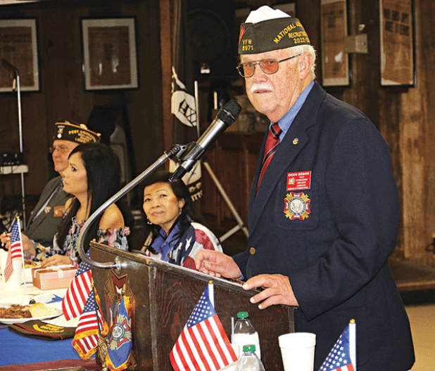 Louisiana VFW State Commander Don Reber speaks at his homecoming celebration on Saturday at the Veterans of Foreign Wars Post 8971 in Eunice. About 170 VFW leaders and members from across the state participated in the  event that honors the state commander. Seated from left, are Donnie Fontenot, Post 8971 commander, Mary Miller, Reber’s daughter, and Thuy Reber, the commander’s wife. (Photos by Harlan Kirgan)
