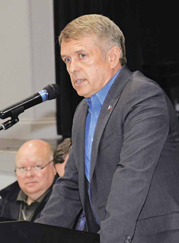 Economic developer Bill Rodier speaks at the State of the Parish meeting in Opelousas on Feb. 7. Seated at left is Van Reed, of Eunice, a St. Landry Parish Government administrator. (Photo by Harlan Kirgan)