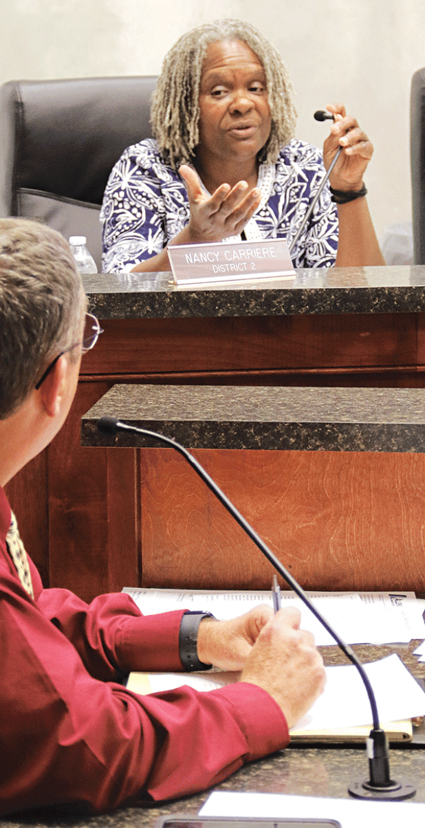 St. Landry Parish Council member Nancy Carriere questions Parish President Jessie Bellard about moving the Confederate monument off the courthouse square. (Photo by Harlan Kirgan)