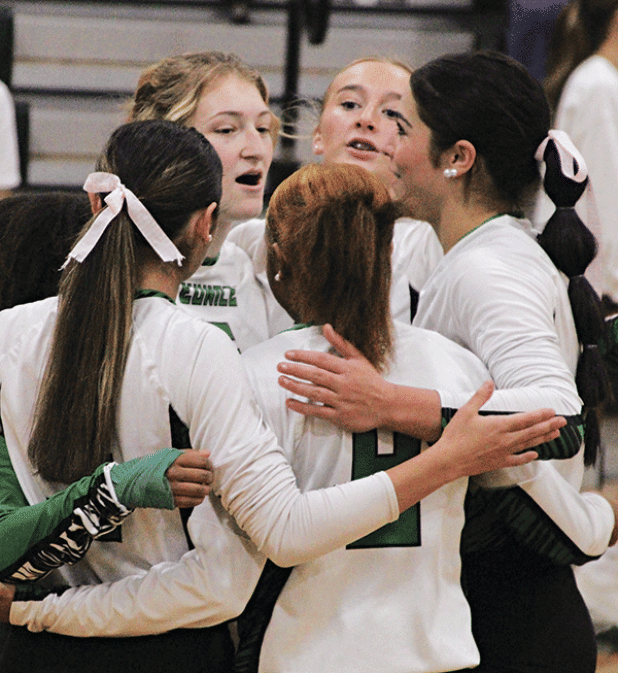 Huddling during the Iota match, are Lady Cats, facing the camera, from left, Destiny Labbe, Ava Grace Brown and  Brooklyn Darbonne. Backs to the camera, from left, are  Jaylee Randall, Lainie Ortego and De’miyah Reed. (Photo by Rhett Manuel)