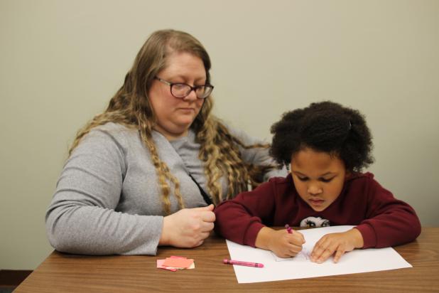 Courtney Bergeaux and Skyla Bergeaux crafting at the library