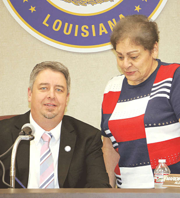 Eunice Mayor Scott Fontenot signs a pledge for a city cleanup in 2026 to mark the 250th year since the Declaration of Independence. With the mayor is Donna Baltakis, director of Keep Eunice Beautiful. (Photo by Harlan Kirgan)