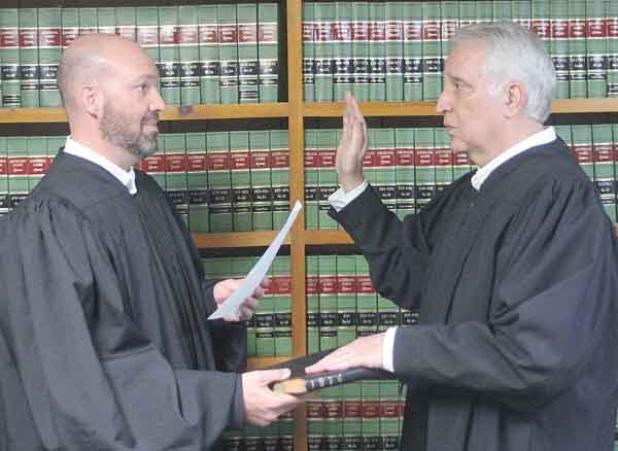 Ville Platte City Judge Greg Vidrine gives the oath of office to newly elected Appellate Judge Gary Ortego of Ville Platte. (Photo by Tony Marks/Ville Platte Gazette) 