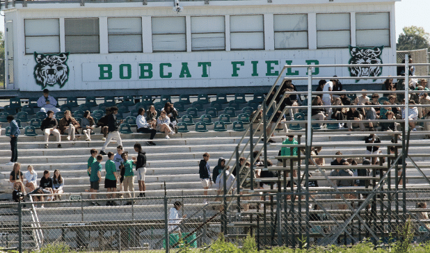 Eunice first-responders were dispatched to Eunice High School Wednesday morning in response to a bomb threat. Roads to the school were blocked. Students are shown in the football stadium as the threat is investigated. (Photo by Harlan Kirgan)