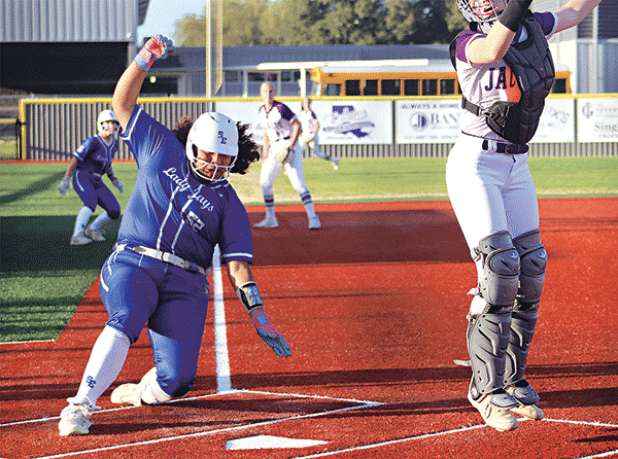 Reagan Gradney scores a run for St. Edmund, but the Lady Jays fell short of Iowa. (Photo by Amy Myers)
