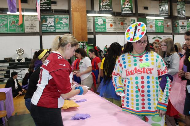 Eunice High students received free T-shirts for their academic achievements during the annual Renaissance Pep Rally held Friday. Above helping with handing out shirts is Brooke LeJeune and at right is Sarah Vienne, a junior.