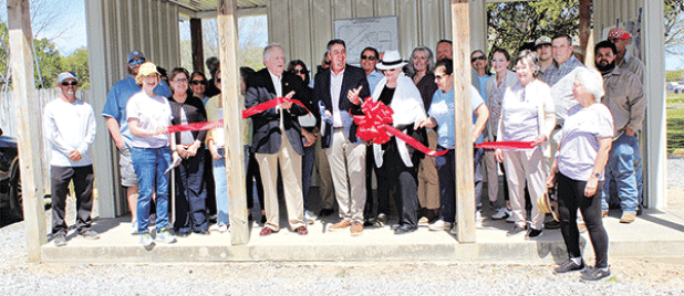 Eunice Mayor Scott Fontenot, center, was joined by former mayors Kenneth Peart and Lynn LeJeune at a ribbon-cutting to celebrate the completion of Bulb and Blossom Garden Club tree marker project at the Eunice Nature Trail and Walking Paark on Tuesday. (Photos by Myra Miller)