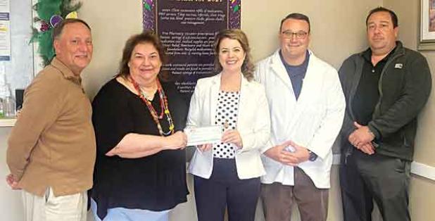 From left, are Randall Vigee, JD Bank, commercial lender; Yancy Fontenot, director for Eunice Community Health Center; Kitty Jo Deshotel, JD Bank Eunice, branch manager; Glynn Michaud, pharmacist for the health center; and Ryan Vidrine, JD Bank commercial lender. JD Bank donated $3,000 to the health center. (Submitted photo) 