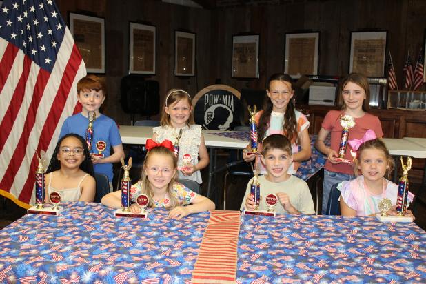 The Veterans of Foreign Wars Post 8971 and the Ladies Auxiliary sponsor Americanism essay contests each year. Winners were named, and cash awards and trophies were presented. Seated, from left, are Charli Rose Papillion, Ruby Bischoff, Case Chapman and Evelina Miller. In back from left are Bryce Duplechain, Rhyn Daggett, Ayda Fuselier and Amelia Daggett. Not pictured are Maxwell Andrepont, Andrew Brown, Lily Briscoe and James Miller. 