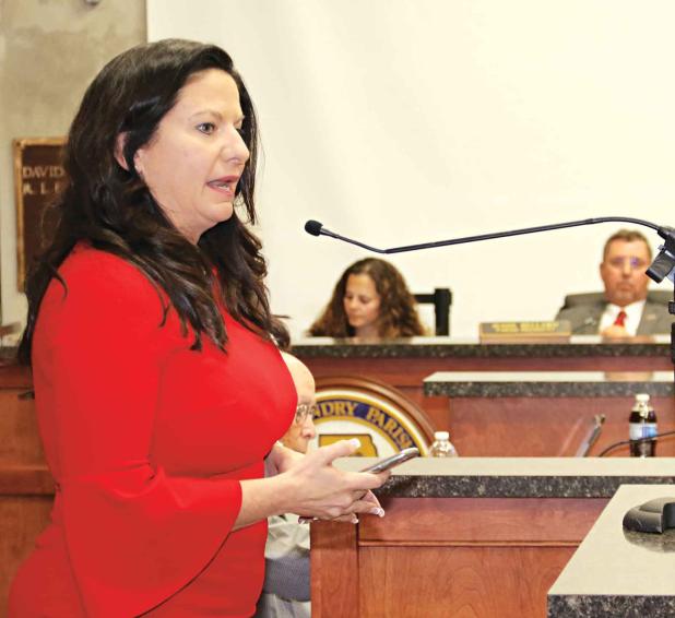 Bambi Polotzola speaks to the St. Landry Parish Council in favor of removing a monument to Confederate soldiers from the St. Landry Parish Courthouse grounds. The meeting was held Wednesday. (Photos by Harlan Kirgan)