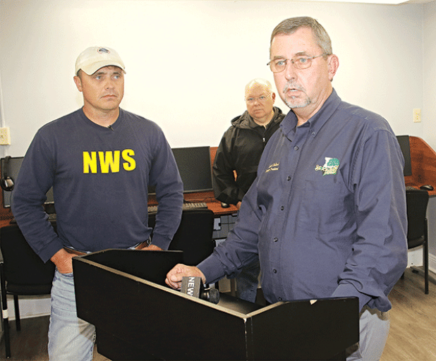 St. Landry Parish President Jessie Bellard, right, speaks at a news conference about Wednesday’s storm held Thursday at the parish courthouse in Opelousas. Also shown, from left, are Doug Cramer of the National Weather Service and Van Reed, parish Emergency Preparedness director. (Photo by Harlan Kirgan)
