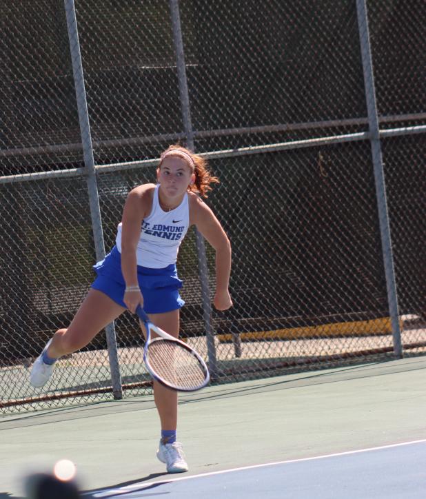St. Edmund High hosted Sacred Heart Tuesday at the Fairgrounds tennis courts. Stella Summerlin is pictured serving and won her match 8-0. (Photo by Amy Myers)