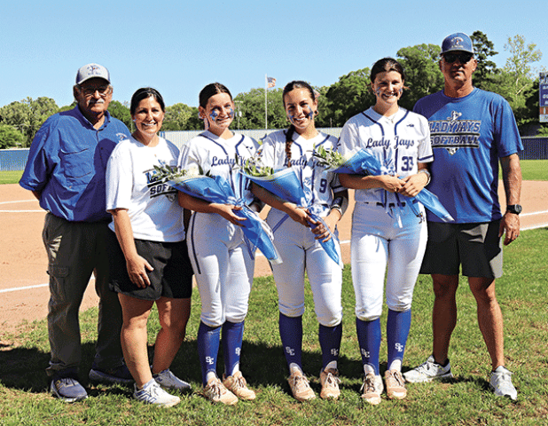 St. Edmund Lady Jays held their Senior night on April 11 before their game against St Louis. The young ladies were presented with flowers and gifts from their coaches, family and friends. Pictured are Coach Harlie Lanthier, Coach Nicole Lanthier, Seniors Emma Myers, Avery Soileau, Kennedy Dubroc and Coach Brock Dubroc. (Photo by Amy Myers)