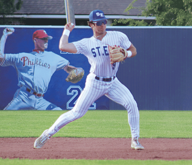 St. Edmund’s Kane West is in action against Comeaux High on April 14. (Photo by Amy Myers)