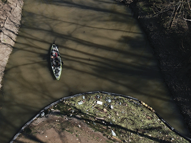 A boom traps litter in Bayou Fountain. (Photo provided by Jeff Kuehny)