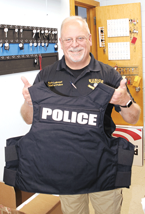 Eunice Police Chief Kyle LeBouef displays one of 15 armored vests the department received last week. (Photo by Harlan Kirgan)