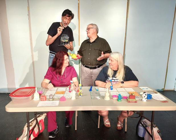 Rehearsing for the upcoming Eunice Players’ Theatre’s play ‘The Queen of Bingo’ are seated from left Stacy Prejean, and Ricci Arnaud. Standing, from left, are Shane Guilbeau and Kevin Miller. (Submitted photo)