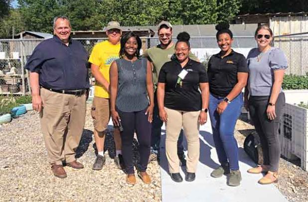 Partnering with Food Farmacy program at the Eunice Community Garden are representatives from Second Harvest. Personnel visited recently at the garden. In front, from left, are Brittany Bowie, impact operations manager; Valerie Thompson, impact coordinator; Kristen Wesley, community nutrition manager; and Lindsay Hendrix, chief impact officer. In back, are Paul Scelfo, regional director; Randy Miller, administrator at Eunice Community Garden; and Paul Ganucheau, volunteer. (Submitted photo)
