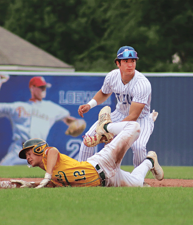 St. Edmund’s Kane West makes a tag at 2nd base in the 5-4 win over Cedar Creek on Wednesday. (Photo by Amy Myers) 