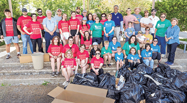 Volunteers fanned out across Eunice on Saturday for the Love the Boot cleanup organized by Keep Eunice Beautiful. Some of the volunteers are shown at the Eunice Municipal Complex with filled trash bags. Donna Baltakis, Keep Eunice Beautiful director, said the Eunice High Spirit Group and National Honor Society spent 3 hours and 48 students picked up 52 30-gallon bags last week. New Hope Fellowship spent 10 hours painting, planting and cleaning up elementary schools with 24 people. On Saturday, 62 people fil