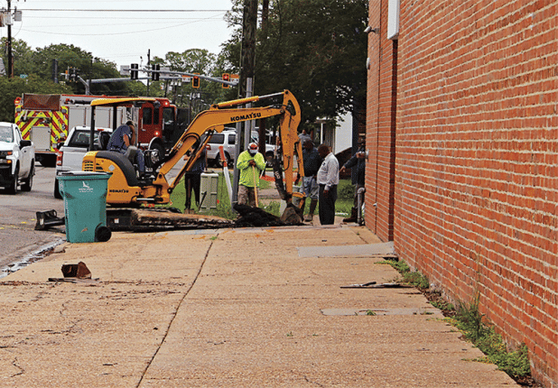 Workers repair a gas leak in the alley behind the Prairie Acadian Cultural Center off South 3rd Street on Monday. The leak caused the evacuation of about 50 people and the closing of about 15 businesses in the downtown area. (Photo by Myra Miller)