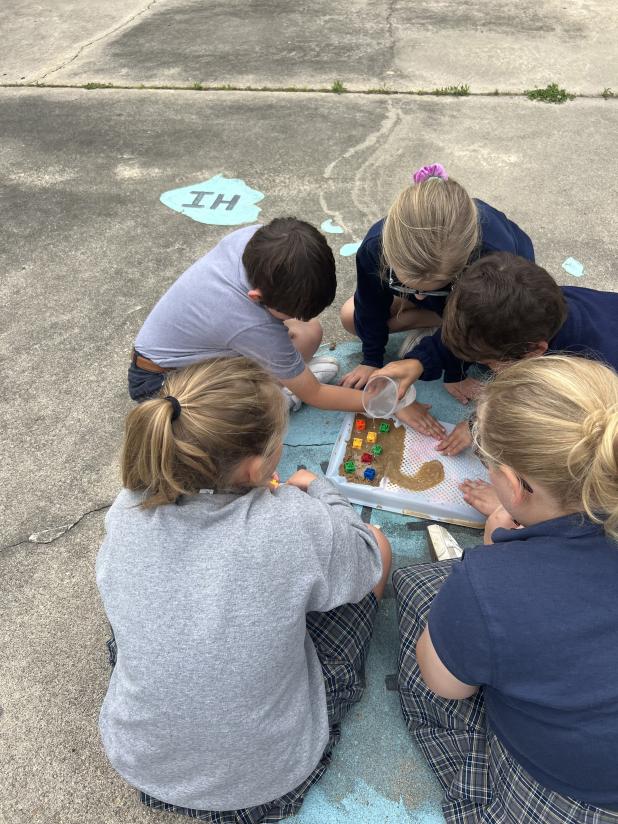 Abby Chapman’s third grade students at St. Edmund Elementary modeled an earthquake to understand how it could change an ecosystem and cause other natural hazards. Then, they acted as civil engineers to build and perform tests on a hurricane-proof model building. From left are  Aubrey Zaunbrecher, Bryson Ardoin, Mary Mire, Brantley Bruce and Amelia Wilson. (Submitted photos)