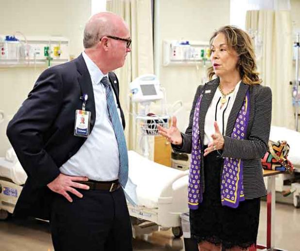 LSU Eunice Chancellor Nancee Sorenson, right, and Ochsner Lafayette General CEO Patrick Gandy are inside the Ochsner Lafayette General Orthopedic Center at the LSU Eunice Allied Health Campus in Lafayette. On Wednesday, the two groups announced a $700,000 expansion. (Photo courtesy of LSU Eunice)   