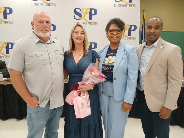 Schouest is pictured with her husband, James Schouest Jr., Superintendent Milton Batiste III and Sylvia Brown.