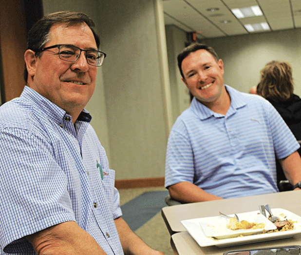 Raymond Aguillard, left, and Andre Aguillard, guest speaker Wednesday at the Eunice Rotary Club meeting. Andre Aguillard spoke about natural gas storage at the Pine Prairie Energy Center. (Photo by Myra Miller)