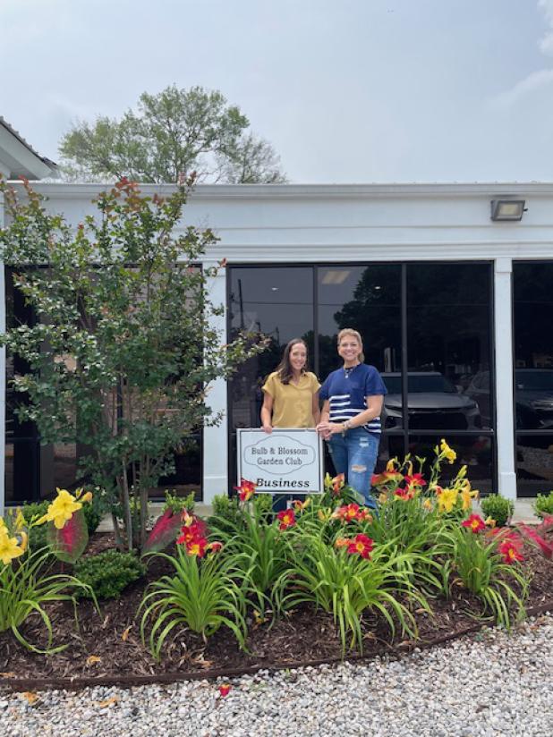 Frey Development, at 161 West Maple, was awarded Eunice Bulb & Blossom Club’s Business Yard of the Month for May. The flower beds feature red and yellow day lilies, elephant ear caladiums, crepe myrtle trees and boxwood shrubs. Pictured are Jessica LeBlue, left, and Gina Lavergne.