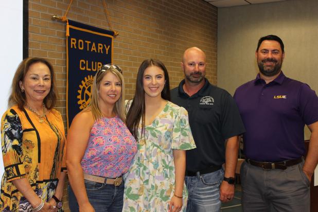 From left, are LSUE Chancellor Nancee Sorenson, Tiffany Pedigo, Olivia Pedigo, Casey Pedigo and Jacob Bergeron, Rotary president. (Photo by Myra Miller) 