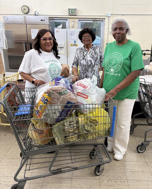 Members of the Eunice Branch National Association of University Women recently visited the Eunice Food Bank to bring a donation of canned goods, staples and delivery bags. 