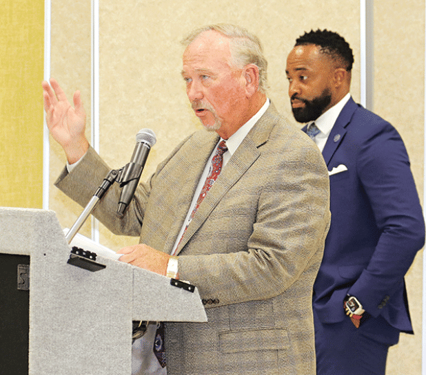 Competing lawyers, from left, Robert Hammonds and Courtney Joiner at Monday’s special School Board meeting. (Photo by Harlan Kirgan)