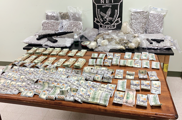 The St. Landry Parish Sheriff's Office released this photo of seized cash, drugs and guns. 