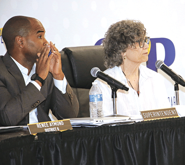 St. Landry Parish School Superintendent Milton Batiste III, left, and School Board President Mary Ellen Donatto at Thursday’s Board meeting. (Photo by Harlan Kirgan)