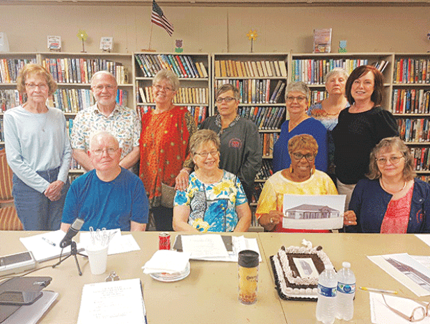 Members of the Evangeline Parish Library Board of Control met with engineers and Friends of the Library members  on June 6 to award the low bid for the new Basile branch library building. Pictured above (left to right, seated) are Bill Fontenot, engineer; Sandra Salazar, board president; Rella Joseph, board vice-president; Lisa Godeaux, secretary and parish library employee; (standing) Linda Lebsack, board member; Ronnie Landreneau, engineer; Suzy Lemoine, co-manager of the Evangeline Parish Library system;