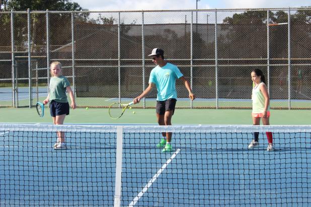 Future tennis players were at the Eunice Recreational Tennis Camp held Monday, Tuesday and Wednesday morning at the Fairground tennis courts. Instructors were tennis team members from Eunice High School. From left, are Caroline Fontenot, 10, Eli Thomas, instructor; and Willa Bollich, 9.