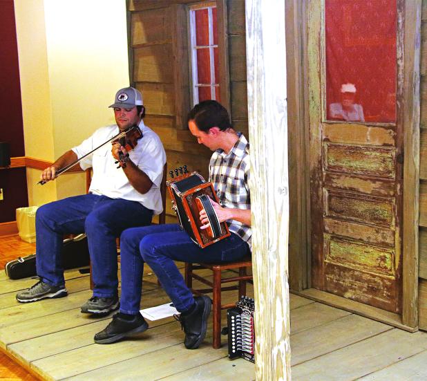 xVieille Maniere musicians, from left, Josh Elkins and Kevin Hilbun perform at the Prairie Acadian Cultural Center’s Rendezvous in the Prairie on Thursday. The program on the center’s front porch stage is an hour of performance and information about the music. The free programs are held from 5:30 to 6:30 p.m. and continue in July. The center is located t 250 W. Park Ave., Eunice. (Photos by Harlan Kirgan)
