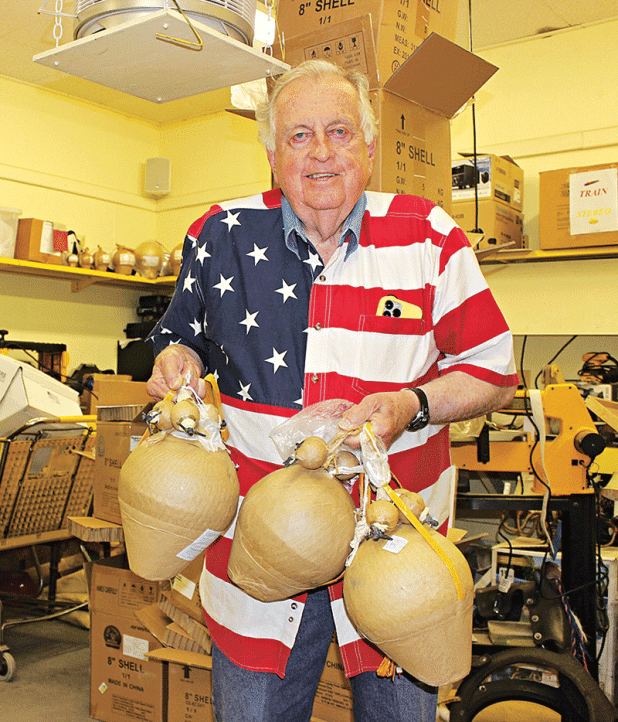 Ken Peart holds the three special shells he plans to use at the Eunice Fourth of July fireworks display. The show starts at 9 p.m. at the Eunice Recreation Complex on Sittig Road. (Photo by Myra Miller)