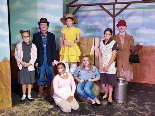 The Eunice Players’ Theatre will open with a summer play “Charlotte’s Web” beginning July 7. Seated, from left are Lillian Veillon as Wilbur, Scarlett Douget as Fairgoer. Standing, from left are Rebecca Fusilier as Fairgoer, Hewson Bourgeois as Mr. Zuckerman, Elle Soileau as Goose, Marley O’Brien as Mrs. Zuckerman, and Demi Vidrine as Fairgoer. (Submitted photo)